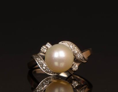 White gold ring set with a cultured pearl...