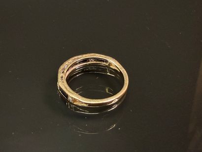 Gold wedding ring set with calibrated sapphires...