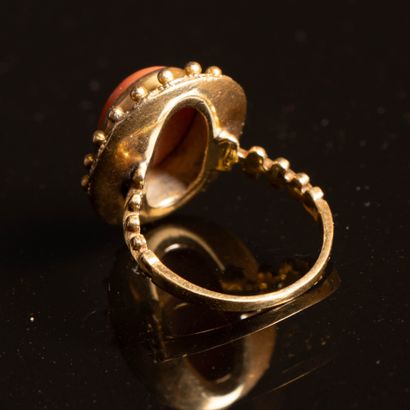 Gold and coral ring. Weight: 5.40 g, 
Necklace,...