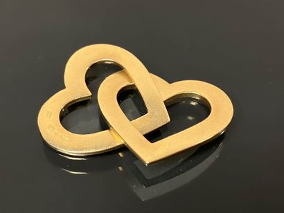 Gold pendant featuring two intertwined hearts,
750°/°°...