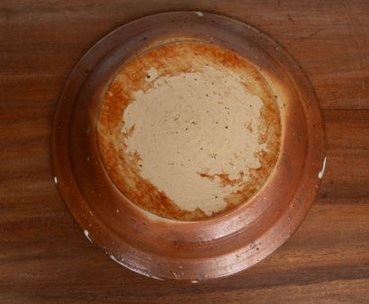 LA BORNE. 
Stoneware dish with enameled interior...