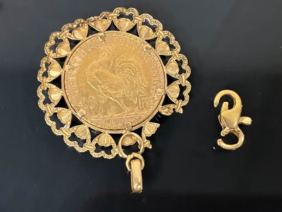 20 francs gold coin, gold setting.
750°/00...