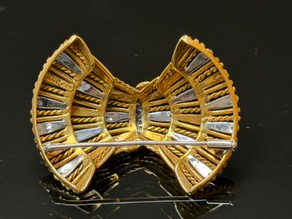 White gold and diamond brooch featuring a...