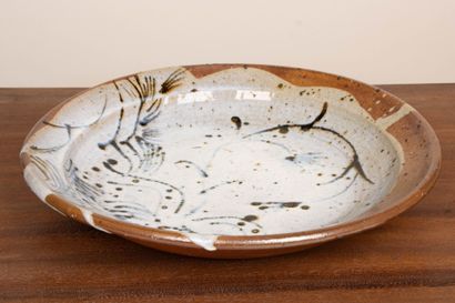 LA BORNE. 
Stoneware dish with enameled interior...