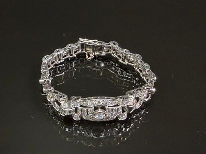 Articulated bracelet in platinum and gold...