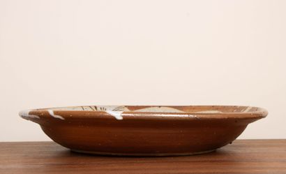 LA BORNE. 
Stoneware dish with enameled interior...