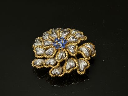 White gold and yellow gold brooch featuring...