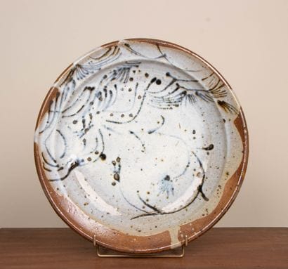 LA BORNE. 
Stoneware dish with enameled interior...