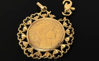 20 francs gold coin, gold setting.
750°/00...