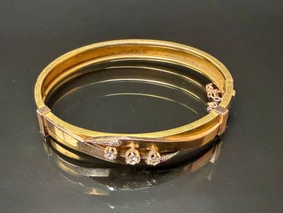 Semi-rigid gold bracelet set with three diamonds,...