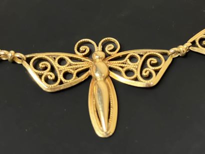 Gold necklace with butterfly design.
750°/00...