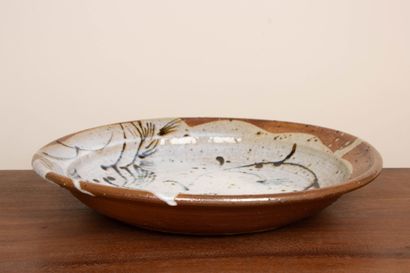 LA BORNE. 
Stoneware dish with enameled interior...