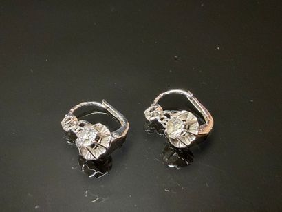 Pair of sleeper earrings in white gold set...