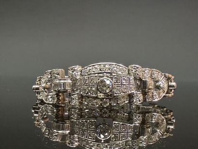 Articulated bracelet in platinum and gold...