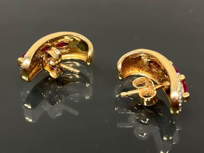 Pair of gold earrings set with small diamonds...