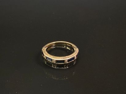 Gold wedding ring set with calibrated sapphires...