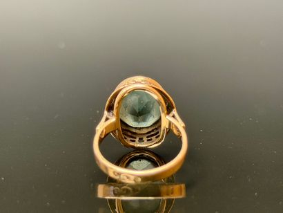 Yellow gold ring set with a green stone.
Polish...
