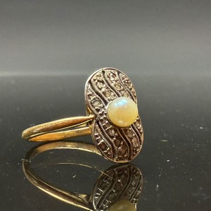 Gold ring set with a cultured pearl surrounded...