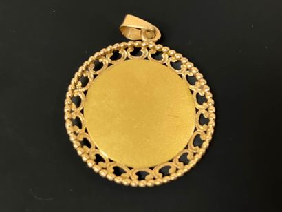 Medal in gold, with virgin in profile and...