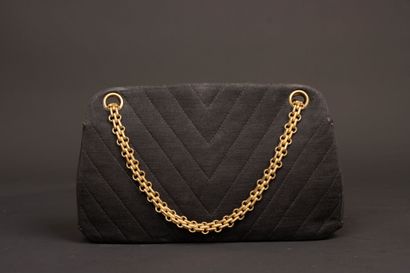 CHANEL. Evening bag in black jersey with...