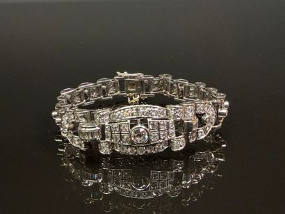 Articulated bracelet in platinum and gold...