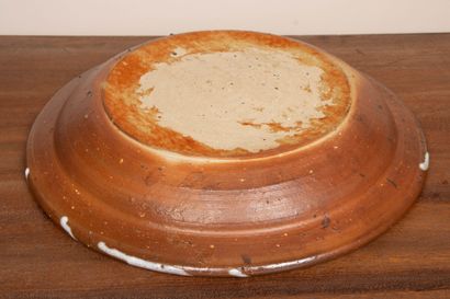 LA BORNE. 
Stoneware dish with enameled interior...