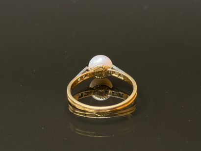 Gold ring set with a cultured pearl.
TDD...