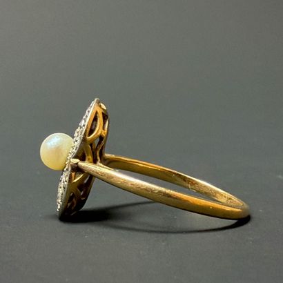 Gold ring set with a cultured pearl surrounded...