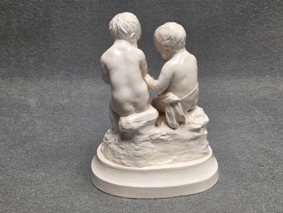 Groupe en faïence fine: deux putti .
22 x...