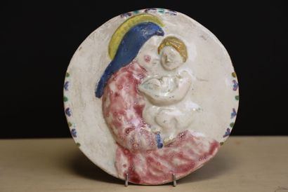 Vierge à l'enfant. 
médaillon en terre cuite...