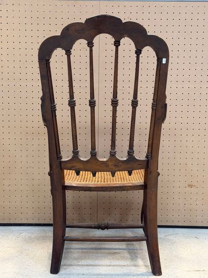 Fauteuil americain, assise cannée. 
Début...