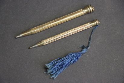 Deux Porte- mine en or 14K. 585°/00
L. :8...