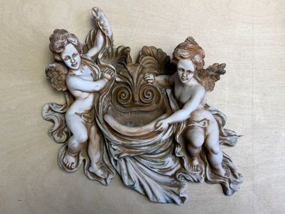Deux bénitiers à décor de putti en biscuit...