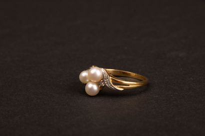 Gold ring set with three cultured pearls...