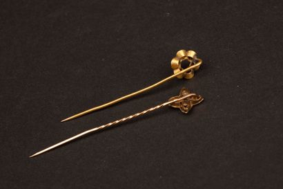 Two gold tie pins.
750°/00 gold. 
Weight:...