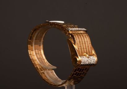 Gold wristwatch featuring a belt motif, accented...