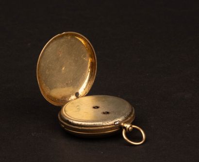 Gold pocket watch with a gold-plated metal...