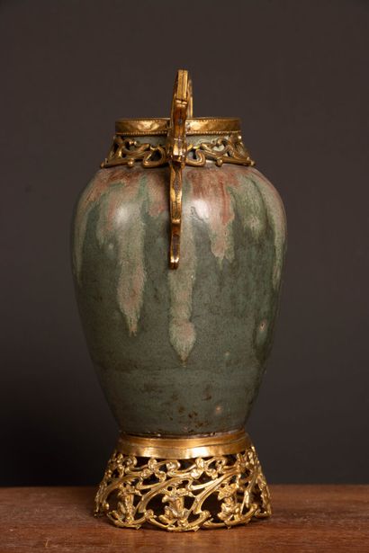 Glazed stoneware vase in shades of green...