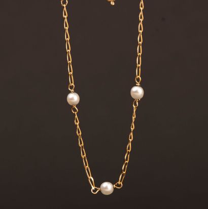 Gold bracelet accented with pearls and a...