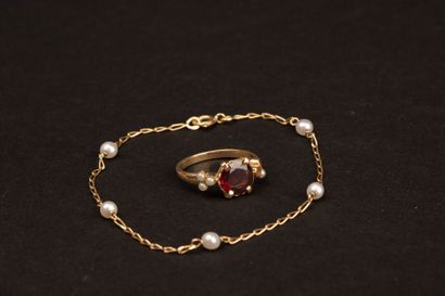 Gold bracelet accented with pearls and a...