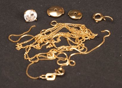 Gold set: two broken chains, a clasp, and...