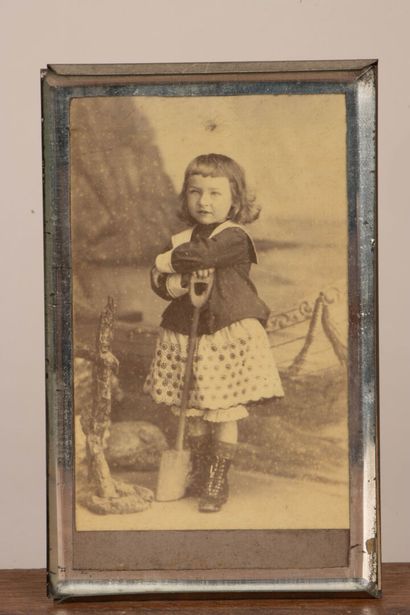 A collection of photographs, including six...