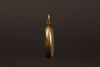 Gold pocket watch with a gold-plated metal...