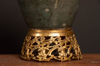 Glazed stoneware vase in shades of green...