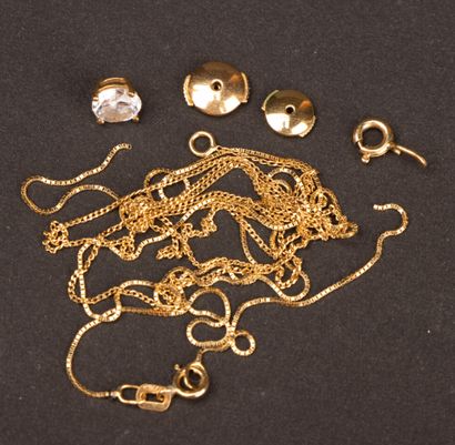 Gold set: two broken chains, a clasp, and...
