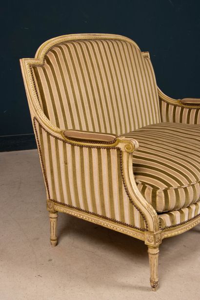 Pair of carved wooden sofas, upholstered...