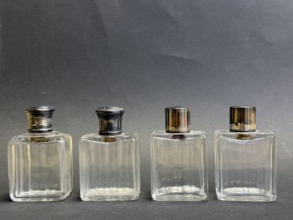 Quatre flacons en verre, monture en argent,...