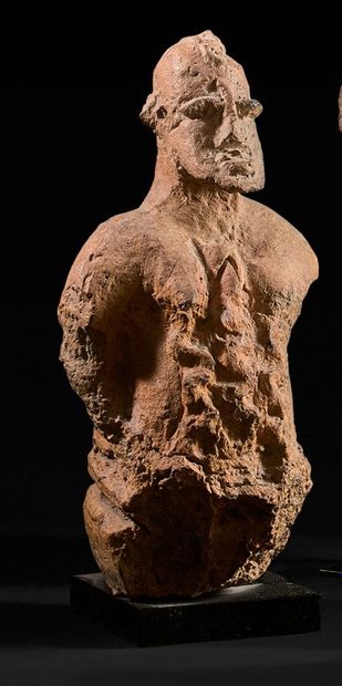 Kneeling figure, abdomen covered with two...