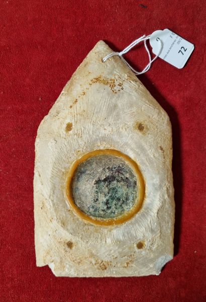 Mirror in the form of a stele decorated with...