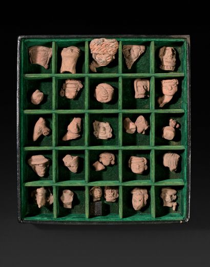 Lot of about twenty-five terracotta heads,...